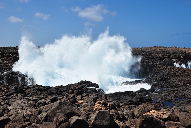 Half-Day Sal Island Tour with Shark Experience from Santa Maria - Ponta Preta beach: black rocks, winter surf, and summer calm